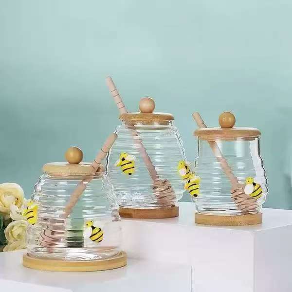 Transparent honey jar with bamboo dipper and lid