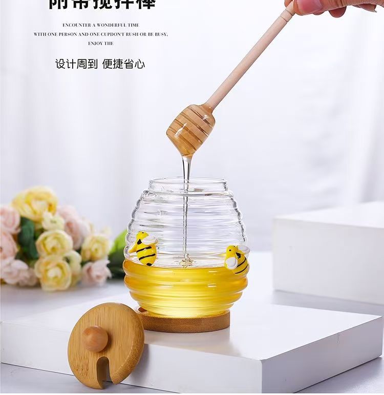 Transparent honey jar with bamboo dipper and lid