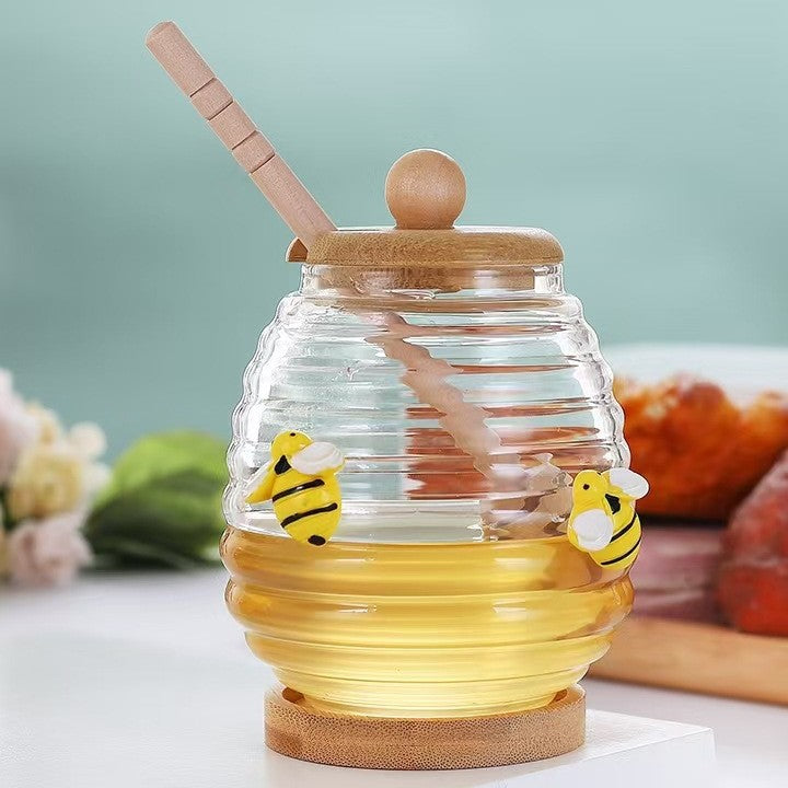 Transparent honey jar with bamboo dipper and lid