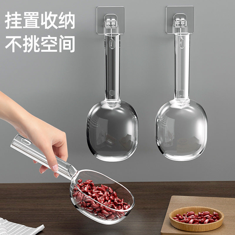 Acrylic  scoop with a long handle and clearly marked measurements